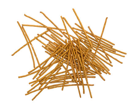 Top view of a jumble of salted whole wheat bretzel sticks isolated on a white background.