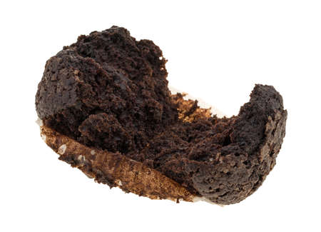 A double chocolate muffin broken open isolated on a white background.の写真素材