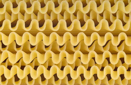 A very close view of the ridged sides of uncooked lasagna.の写真素材