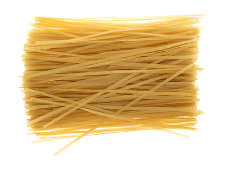 Top view of a portion of brown rice pasta fettuccini isolated on a white background.の写真素材