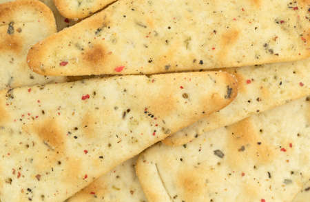 A very close view of seasoned pizza crust chips.の写真素材