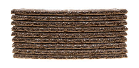 A large stack of chocolate graham crackers isolated on a white background.の写真素材