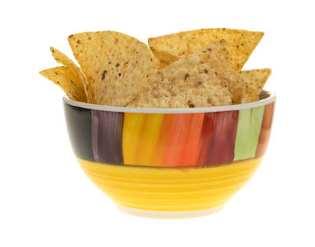 A colorful bowl filled with crispy tortilla chips isolated on a white background.の写真素材