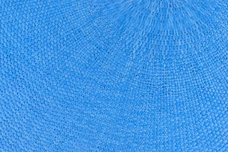 A very close view of a place mat made with woven blue dyed cloth.の写真素材