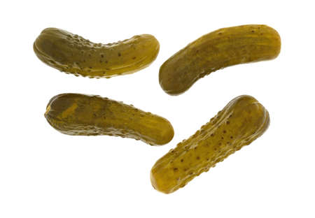 Top view of four kosher baby dill pickles isolated on a white background.の写真素材