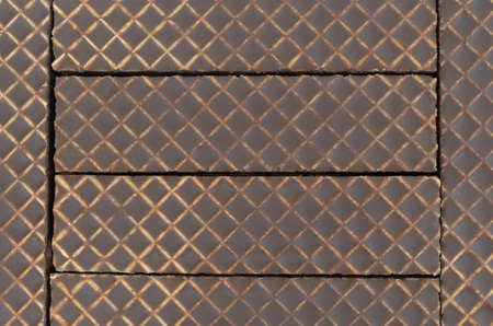 A very close view of several chocolate covered peanut butter wafer cookies.