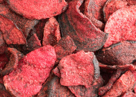 A very close view of salted red beet chips.の写真素材