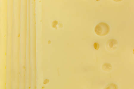 A very close view of low sodium Swiss cheese slices.の写真素材