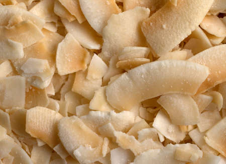 A very close view of freshly toasted coconut flakes.の写真素材