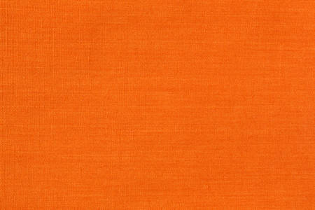 Close view of a piece of bright orange cloth.の写真素材