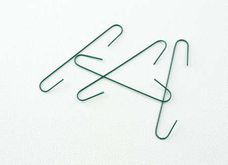 Several green Christmas ornament hangers on a white background.の写真素材