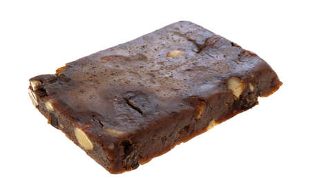 Side view of a almond, cashew and date chocolate protein bar isolated on a white background.