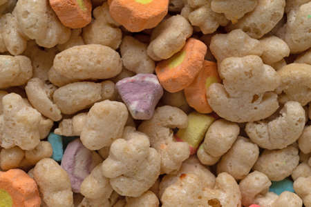 Close view of generic crunchy breakfast cereal with fruit flavored bits.