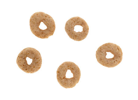 Top view of five pieces of toasted oat breakfast cereal isolated on a white background.の写真素材
