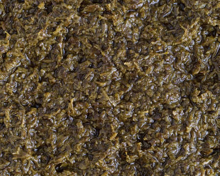 Top close view of chopped parsley in canola oil.の写真素材