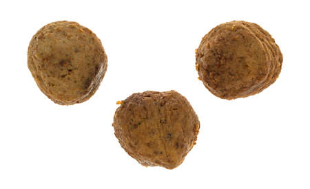 Top view of a group of three meatballs isolated on a white background.