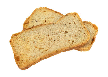 Side view of two slices of rye melba toast isolated on a white background.