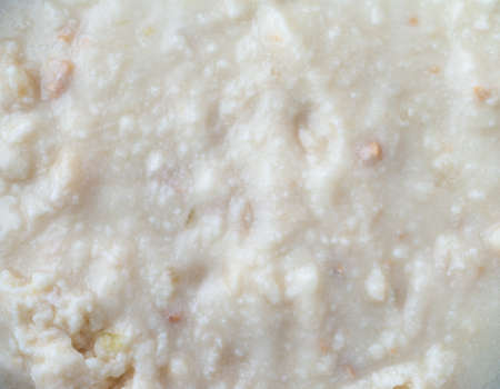 Top close view of cold canned clam chowder.