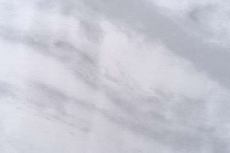 Very close view of a fake gray and white marble vinyl floor tile.の写真素材