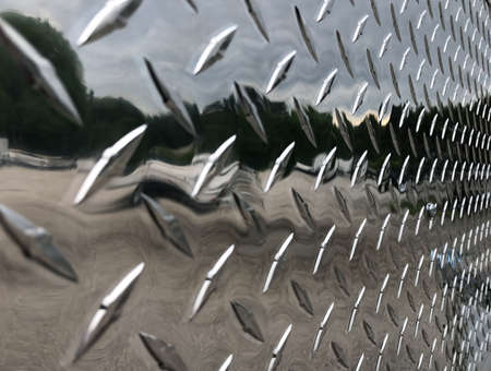 Close view of shiny aluminum metal on a trailer on an overcast day.の写真素材