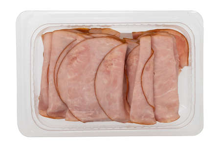 Thin sliced ham in a plastic tray isolated on a white background.の写真素材