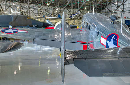 Aged air force plane with prop engines and shiny aluminum skin still bright