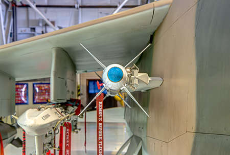 Air to air missile under the wing of a jet fighter.