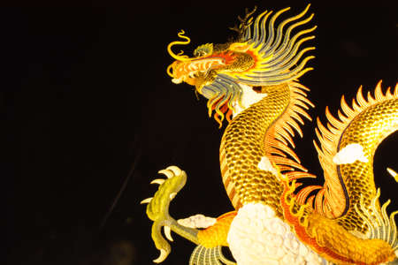 Golden dragon at Nakornsawan province in the dark nightの写真素材