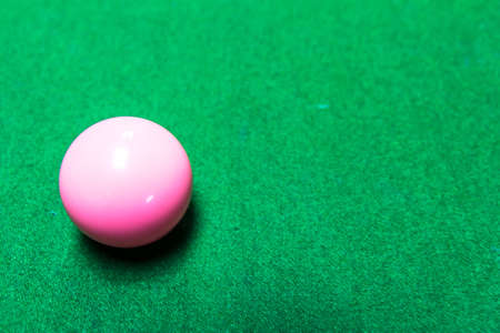 Ping ball snooker game on the green floor の写真素材