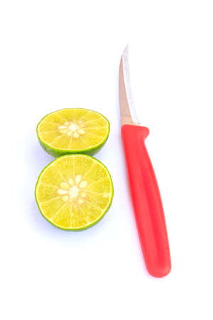Fresh lime and red cutter on white backgroundの写真素材