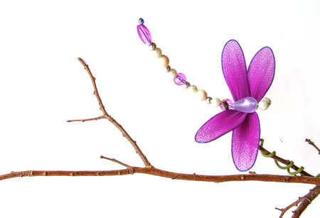 Close up handmade dragonfly with white backgroundの写真素材