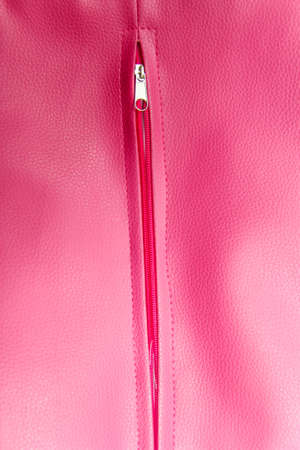 Close up of zipper on pink coat with textureの写真素材