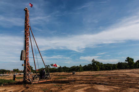 Pile driver at a construction site with blue skyの写真素材