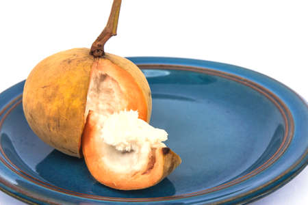 Santol fruit on plate isolated on white background