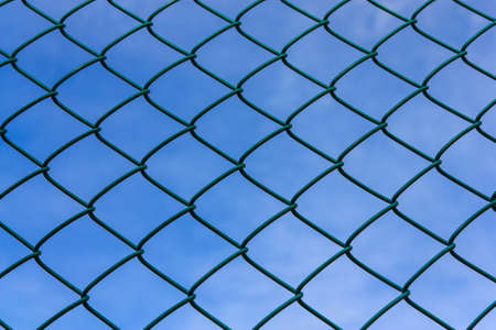 Texture from metallic net with blue skyの写真素材