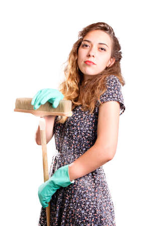 Young housewife cleaner  Over white backgroundの写真素材
