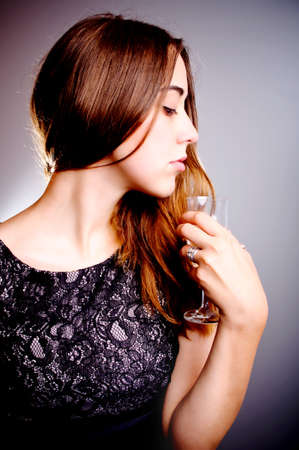beautiful woman with glass of wineの写真素材