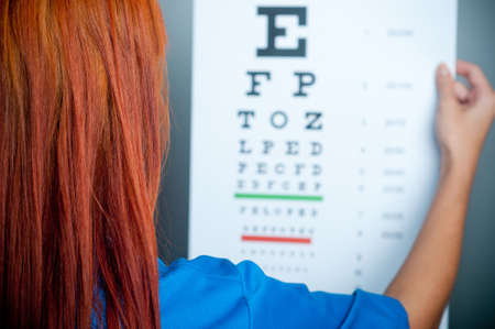 a doctor watching a test for eye examinationの写真素材