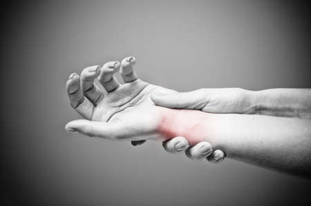 Acute pain in a women wristの写真素材
