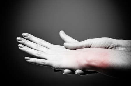 Acute pain in a women wristの写真素材