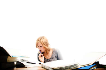 Stressed student revising for an exam - isolated on white backgrgroundの写真素材