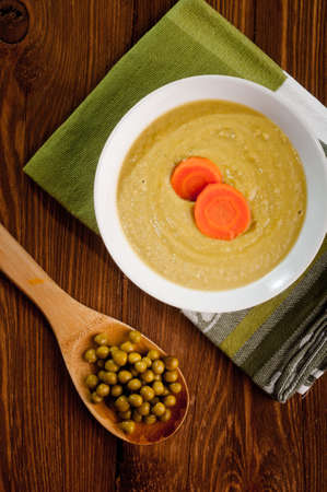 Bowl with green bean soup, on a wooden backgroundの写真素材