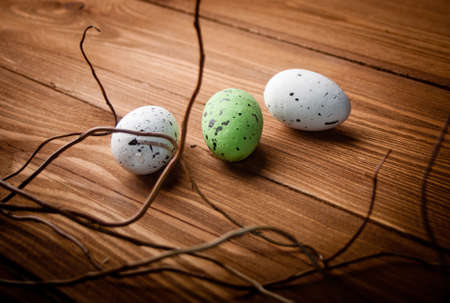 Easter eggs on wooden plankの写真素材