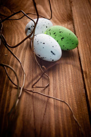 Easter eggs on wooden plankの写真素材
