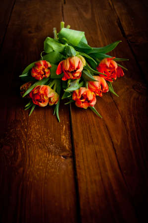Tulips on rustic wooden tableの写真素材