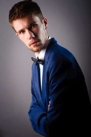 Portrait of handsome stylish man in elegant blue suitの写真素材