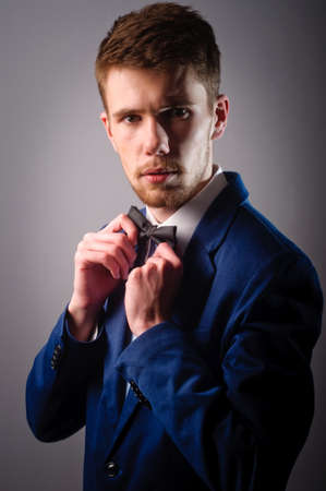 Portrait of handsome stylish man in elegant blue suitの写真素材