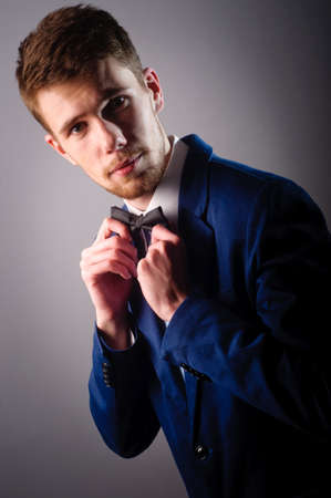 Portrait of handsome stylish man in elegant blue suitの写真素材