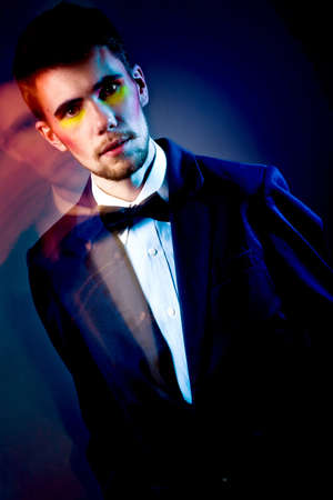 abstract fashion shot. color portrait of a young manの写真素材