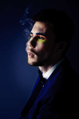 abstract fashion shot. color portrait of a young manの写真素材